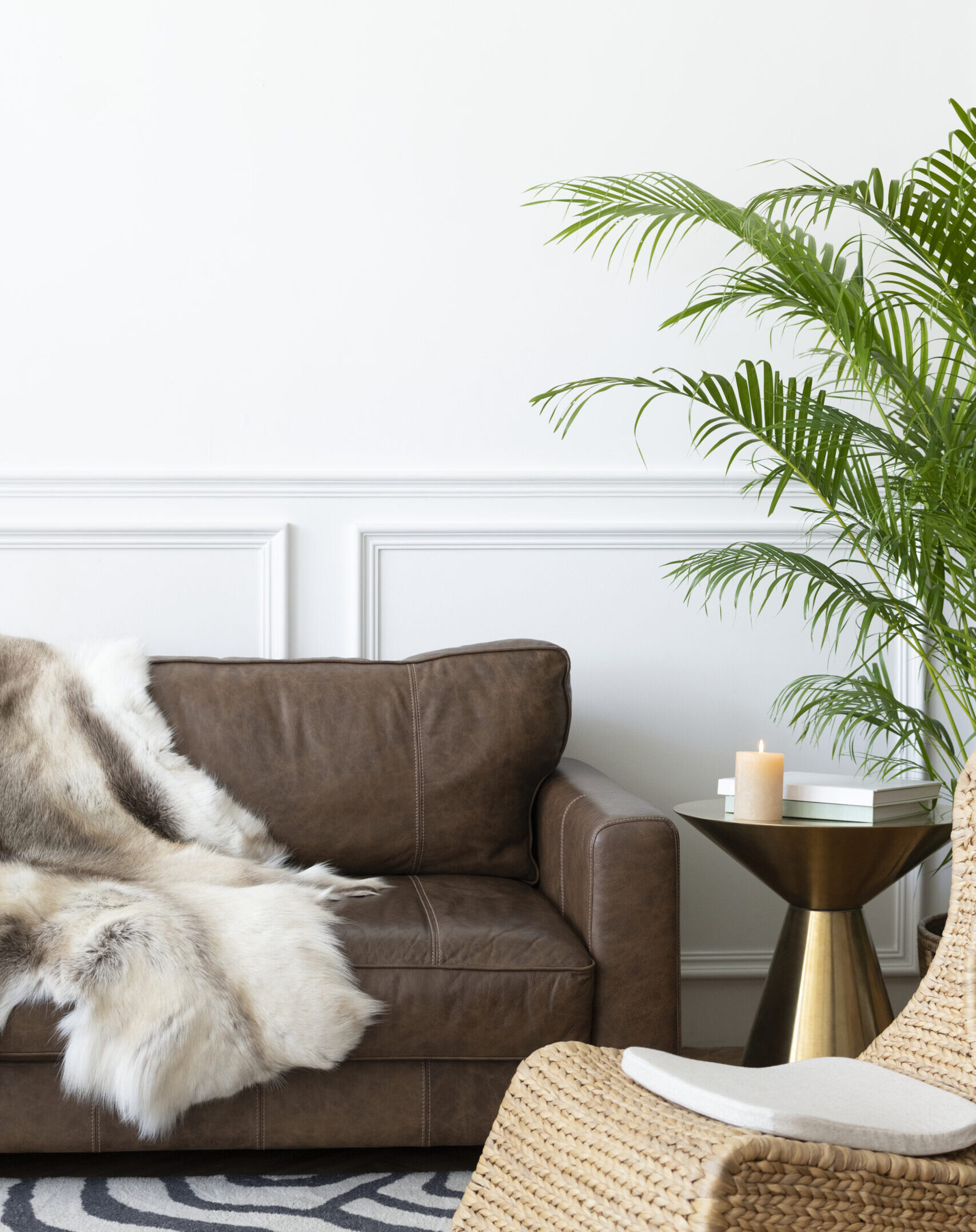 Cozy modern industrial style room with animal fur throw and rattan armchair