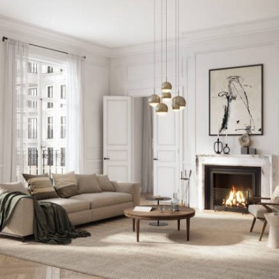 A bright, minimalist living room featuring a beige sofa, modern fireplace, and abstract art. Large windows let in natural light, creating a cozy yet sophisticated atmosphere.